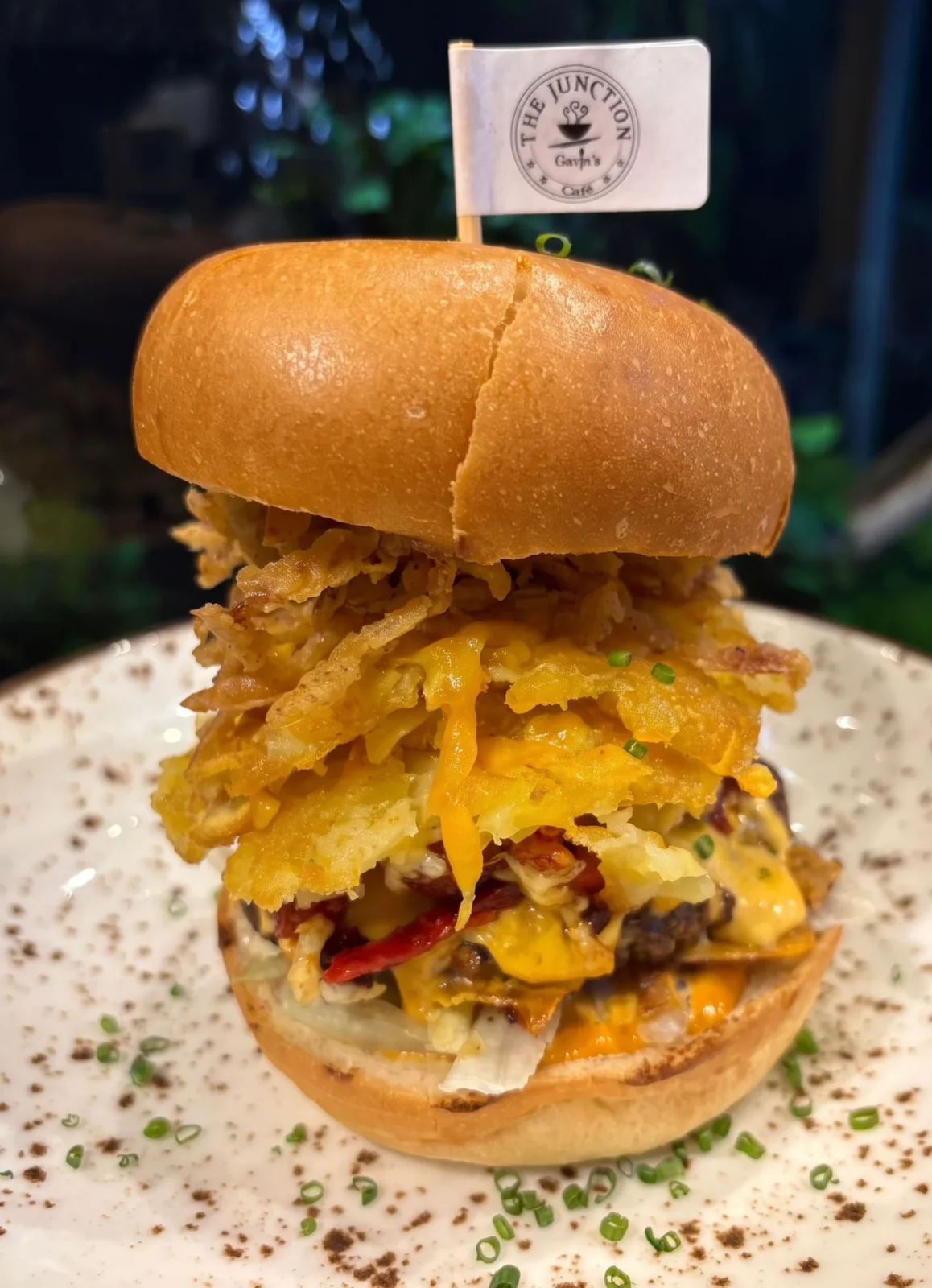 Stacked burger with crispy onions and melted cheese