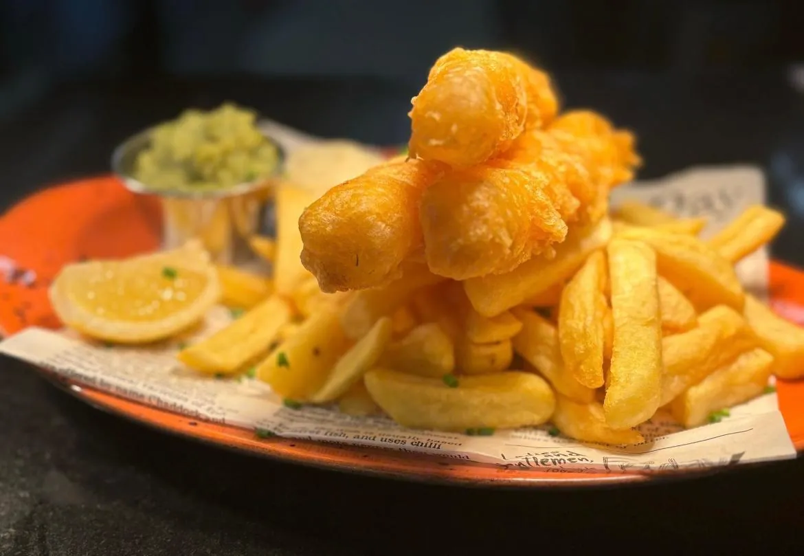 Fish goujons and chips with mushy peas and tartar sauce