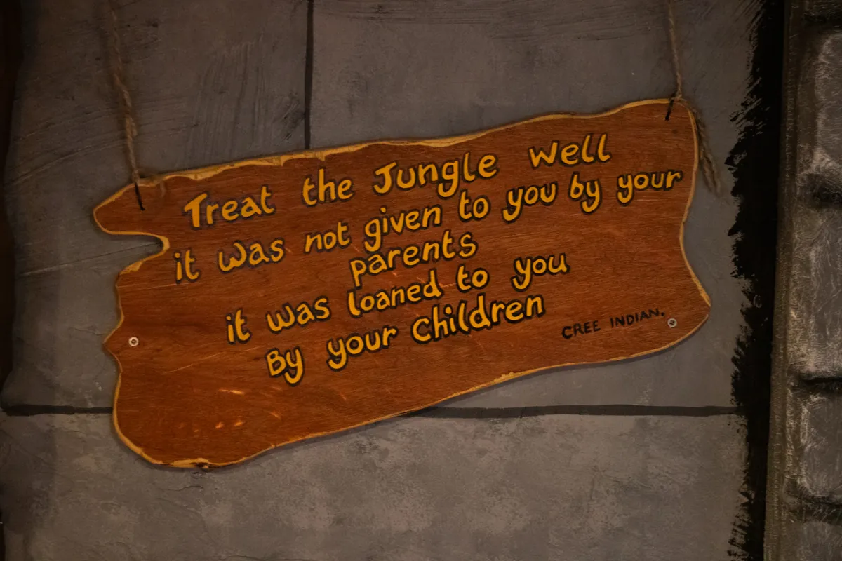 A hand-painted sign: treat the jungle well