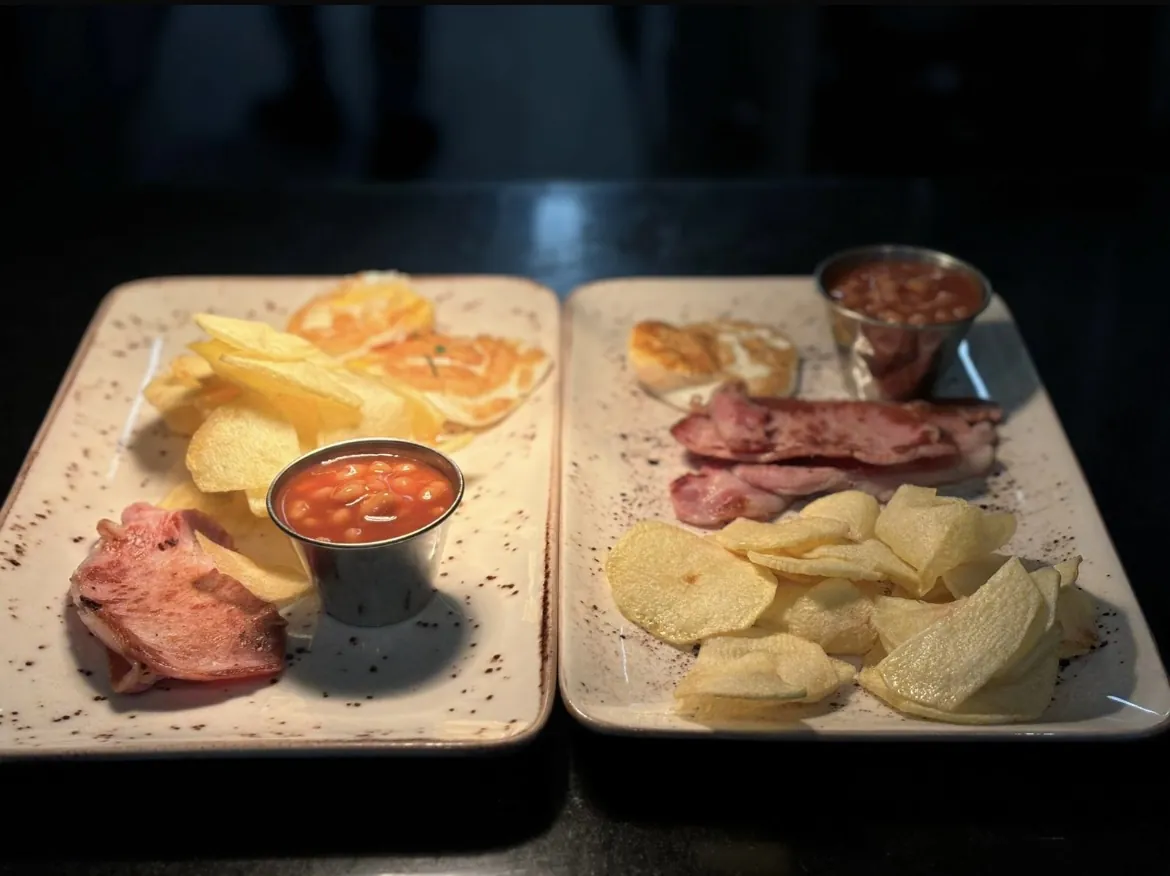 Breakfast plates with rashers, sausages and beans