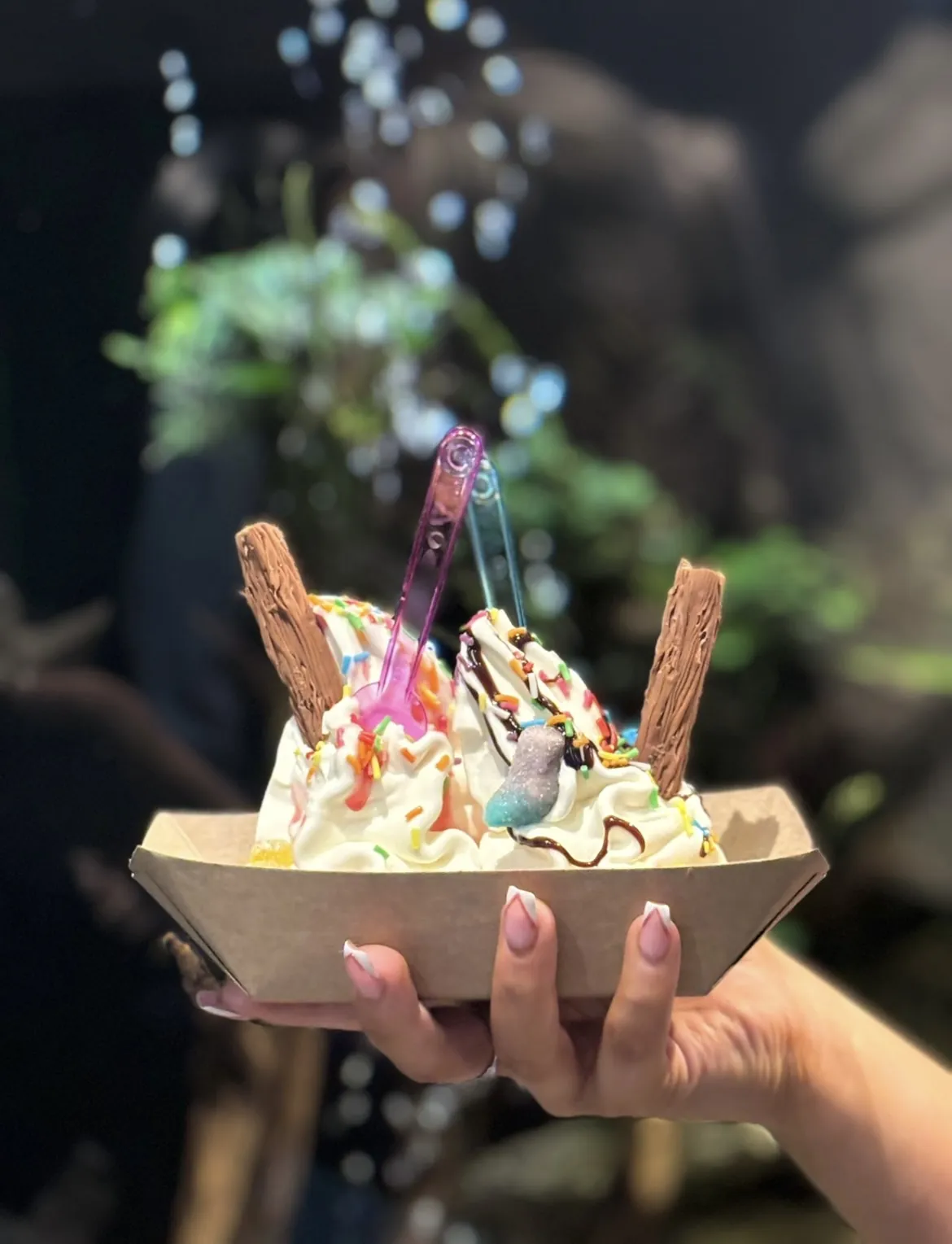 A sweet boat sundae held up in the jungle room