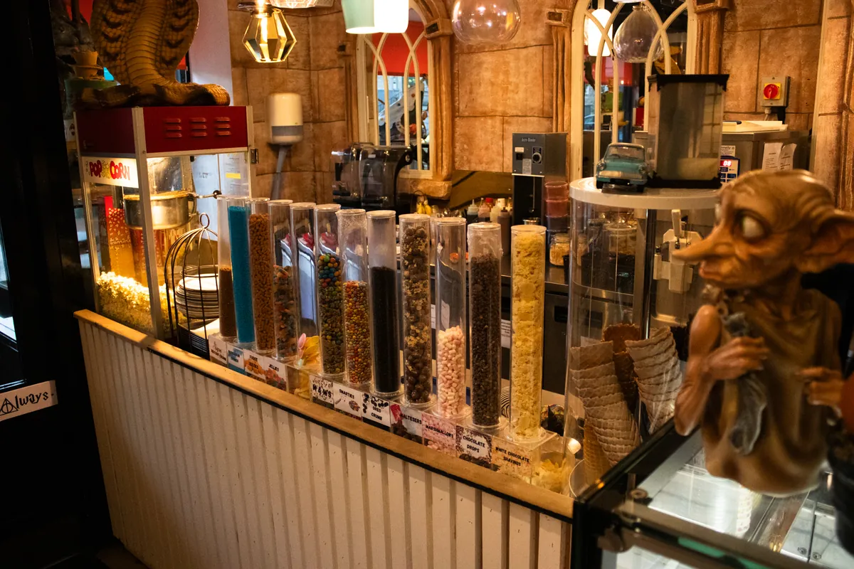 The gelato counter with toppings, popcorn and Dobby