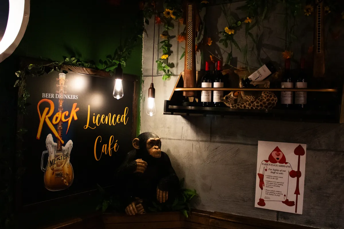 The Rock Licenced Café sign with the chimp statue