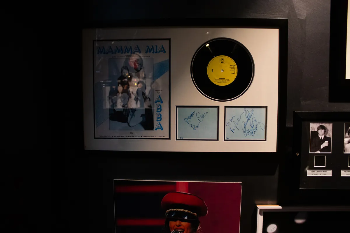 An ABBA record framed with the Mamma Mia artwork.
