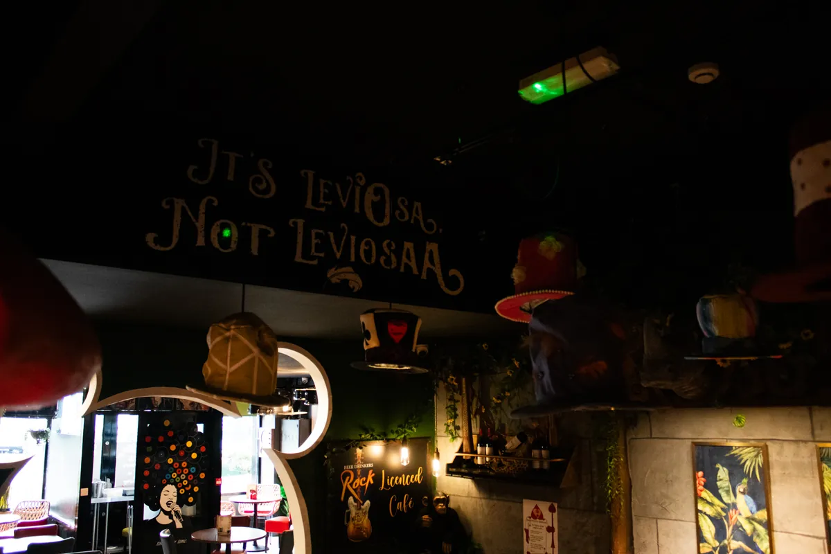 "It’s LeviOsa, not LeviosAA": the sign over the wizarding corner.