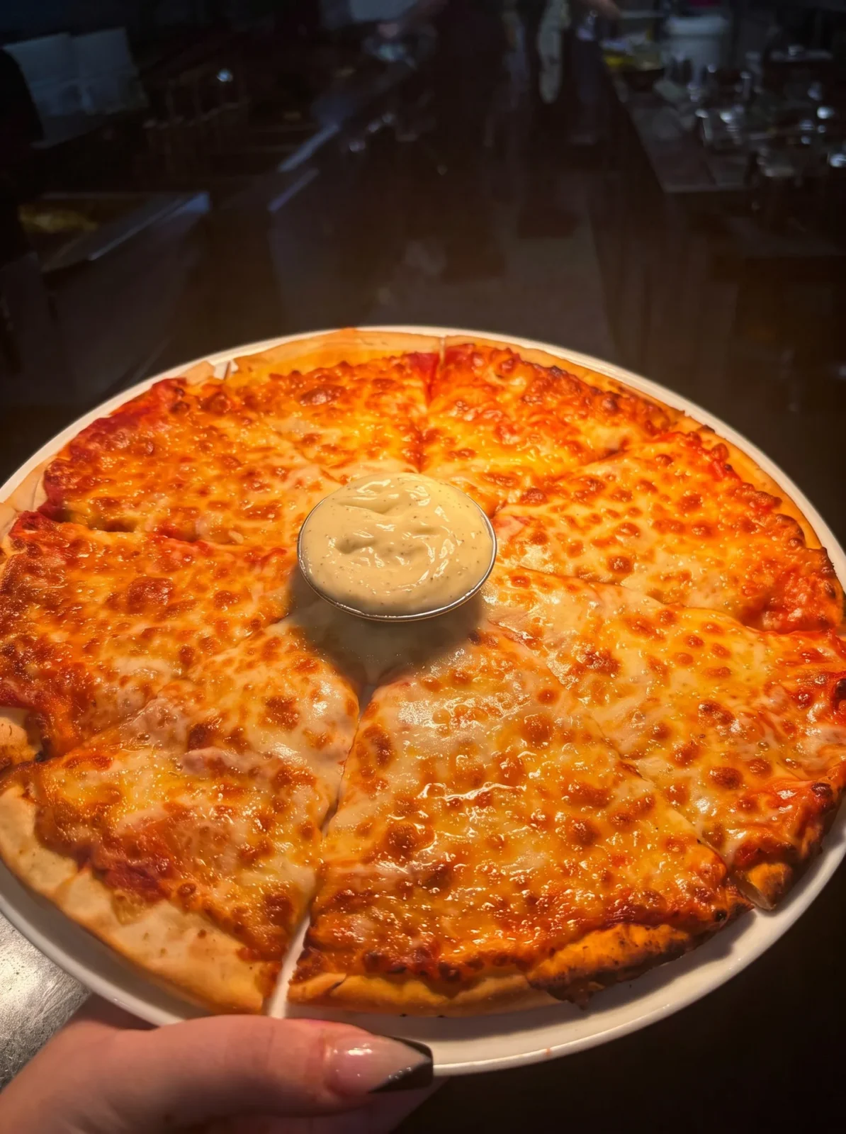 Margherita pizza with a garlic dip